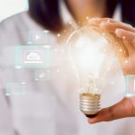 Woman hand holding light bulb with innovative and creativity are keys to success and show technology icon social media. Woman hand holding light bulb with innovative and creativity are keys to success and show technology icon social media.